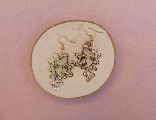 Boucles d'oreilles visage blanc