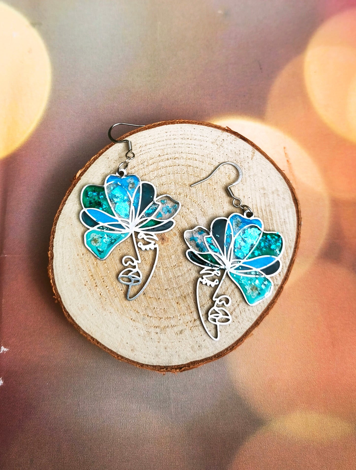 Boucles d'oreilles visages bleu